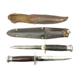 American WW2 type fighting knife the 15cm steel double edged blade marked to the ricasso William Rodgers Sheffield England, nickel crosspiece, leather bound grip and aluminium pommel L27cm overall; and another similar fighting knife with aluminium crosspiece; both in leather sheath (2)