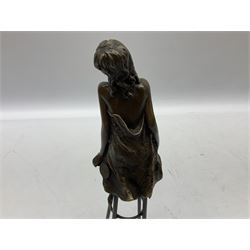 Art Deco style bronze modelled as a bare chested female figure, seated upon a chair, after 'Pierre Collinet', H26.5cm