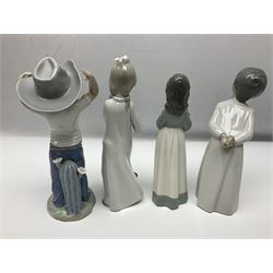 Eleven Nao figures to include Cowboy, Girl with Puppy, Clown, Girl in hat etc 