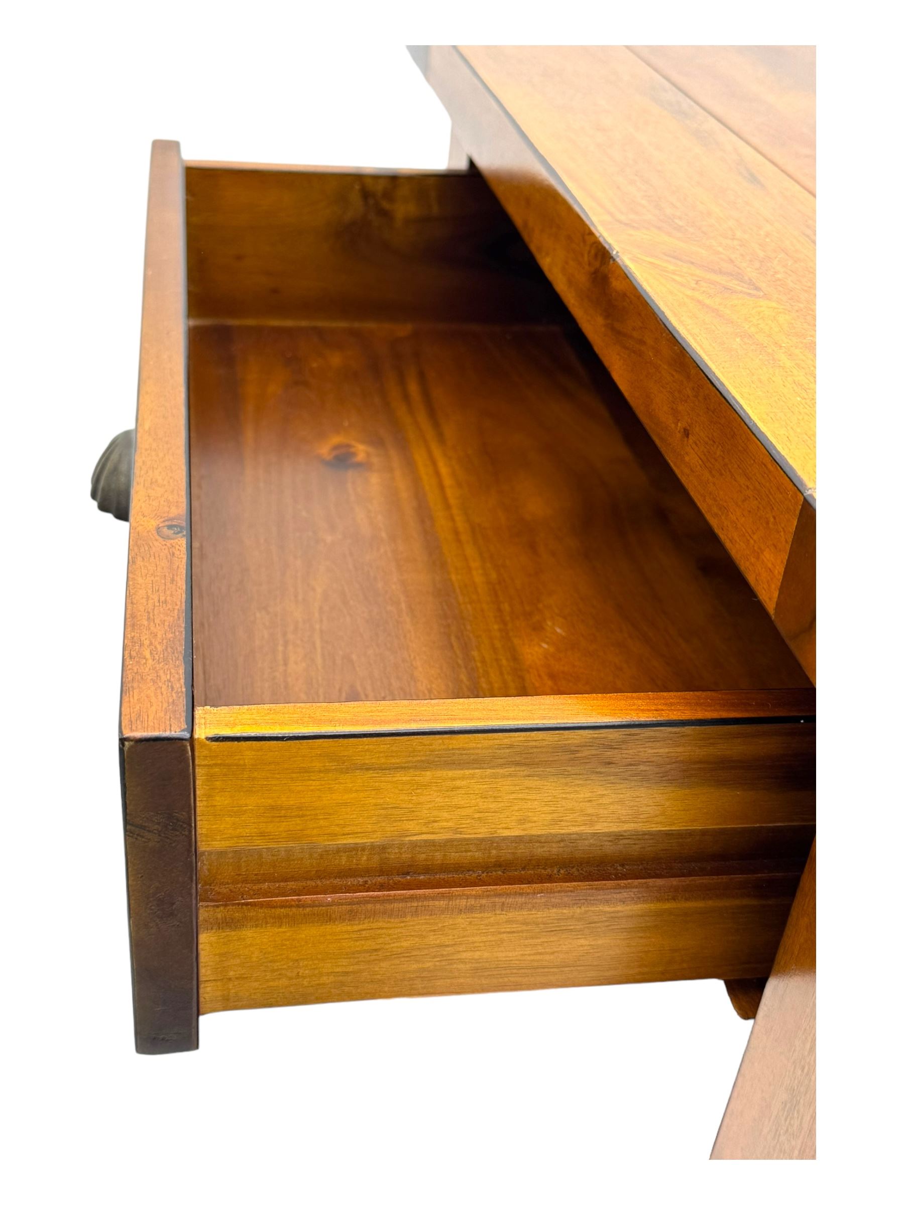 Contemporary hardwood side table, rectangular top over two drawers with shell cup handles, open shelf below, raised on square tapering supports