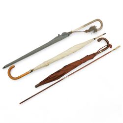 Umbrella with 9ct gold mounts (Brigg), snakeskin umbrella (Paragon by S Fox & Co Ltd), another umbrella (Peerless) and gun cleaning stick (4)