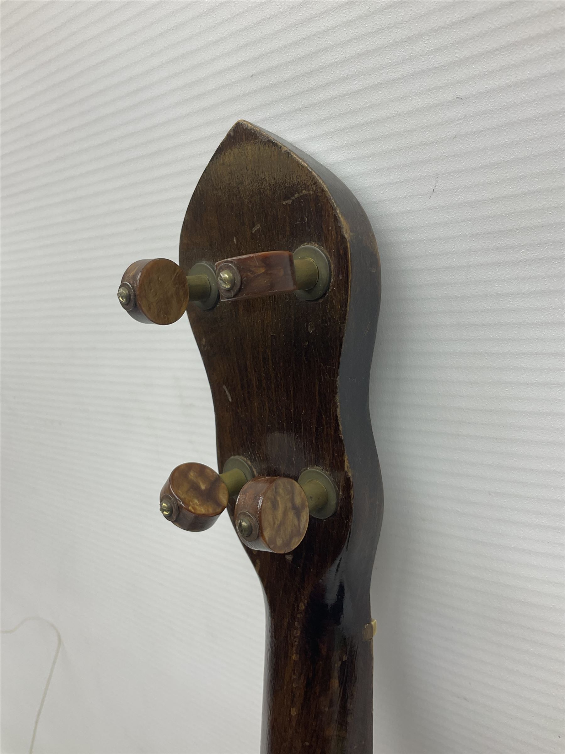 George Formby banjolele with metal plaque to headstock L55cm; in carrying case with instruction booklet.