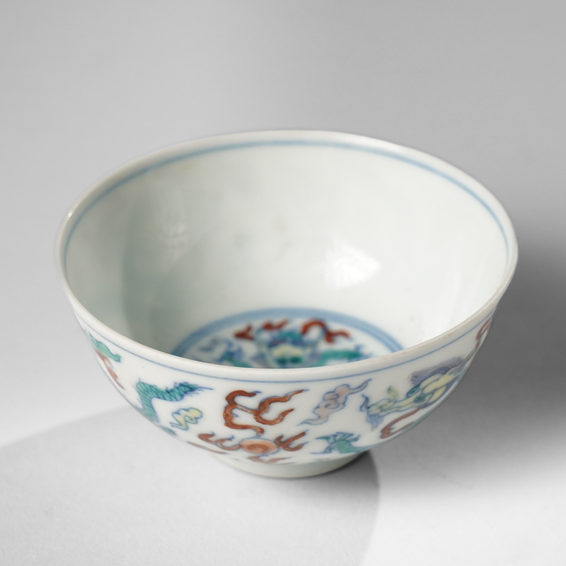 Chinese doucai wine cup, painted with a dragon, apocryphal six character Yongzheng mark to base, H3.5cm D7.5cm 