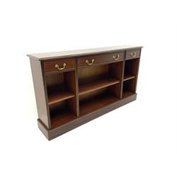 Sydney Smith - mahogany sideboard, cross banded and inlaid detail, three short drawers above three adjustable shelves, raised on platform base