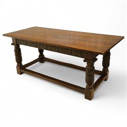 17th century revival oak refectory table, rectangular plank top above a scallop shell carved frieze and baluster turned legs carved with scallop shell and Gothic tracery, joined by stretchers