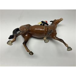 Beswick jockey on walking horse no 1037, in black white and yellow jockey colours, with printed mark beneath, H22cm