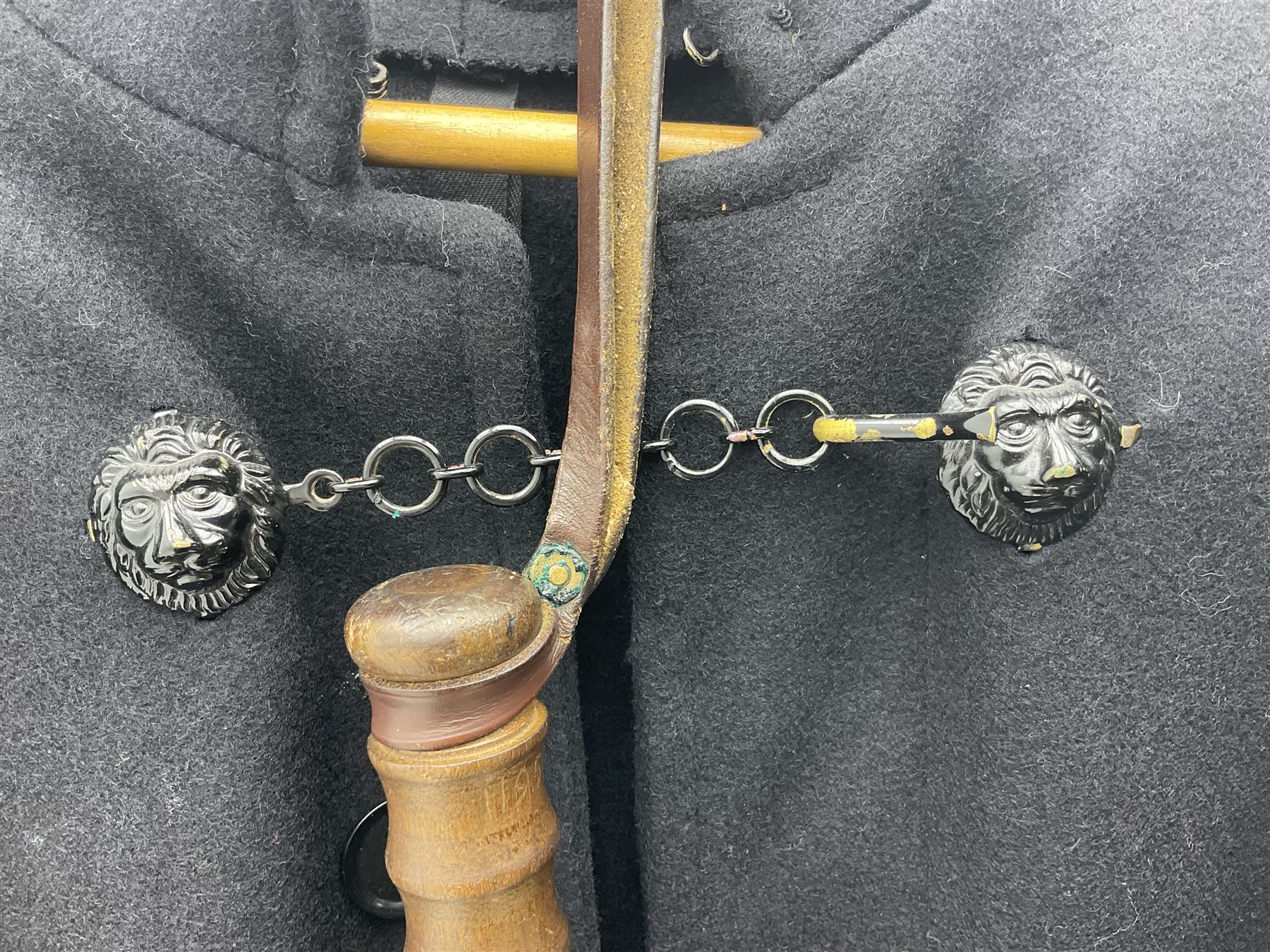 Police Constabulary style uniform items comprising woollen night cape / cloak with chain fastening, helmet and truncheon