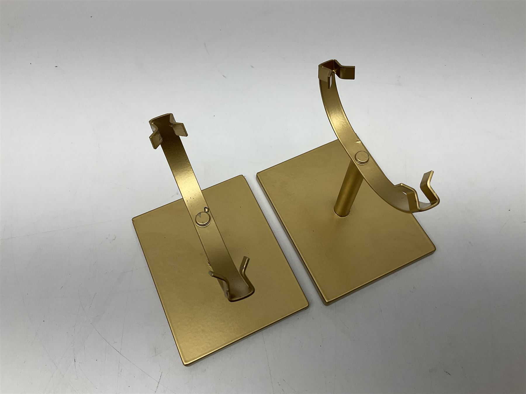 Pair of purple agate slices, polished with rough edges raised upon gilt metal stands