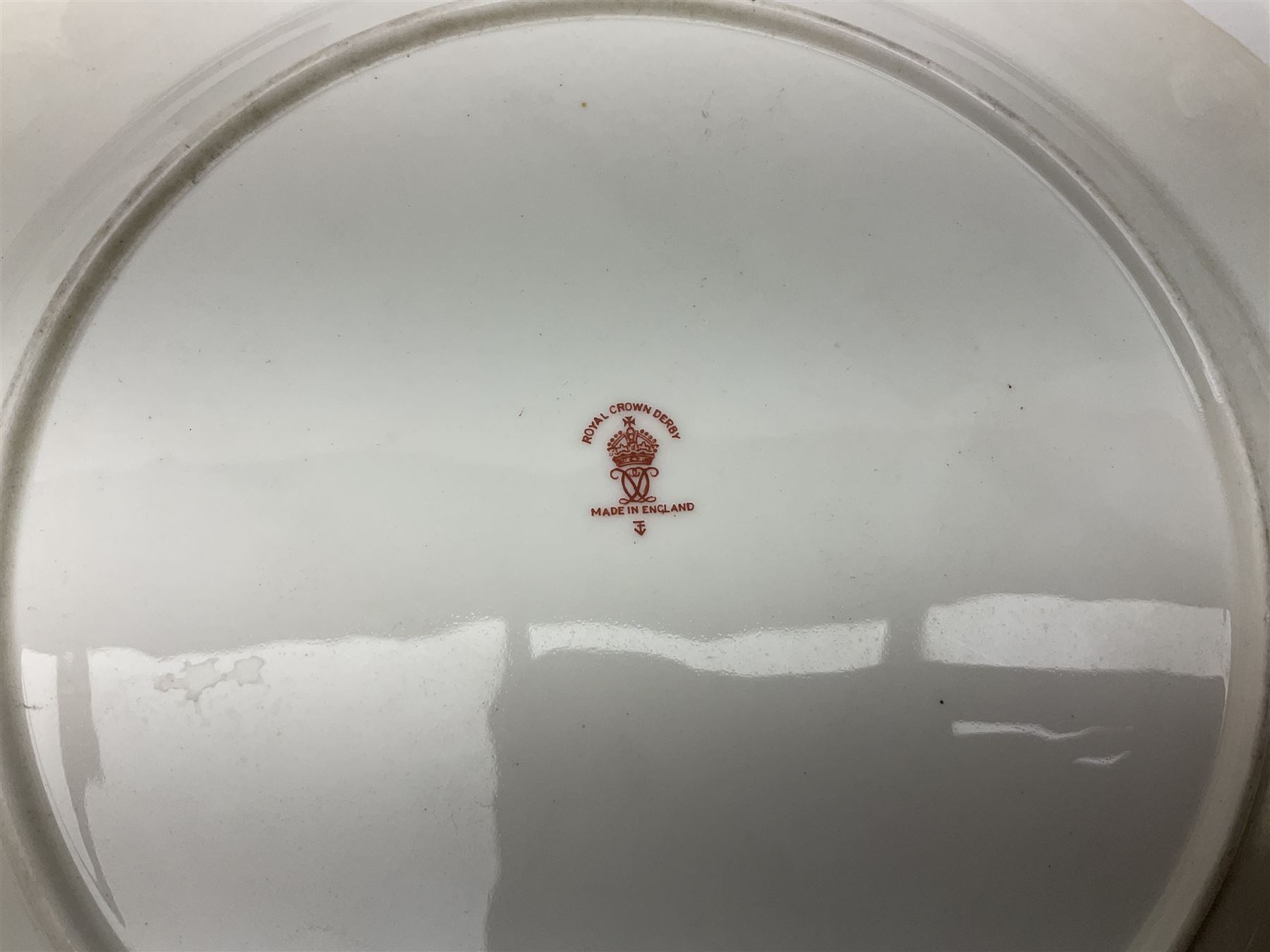 Royal Doulton toby jug of Winston Churchill H23cm and large character jug of Falstaff; together with four collector's plates by Royal Crown Derby, Royal Worcester and Limoges (6)