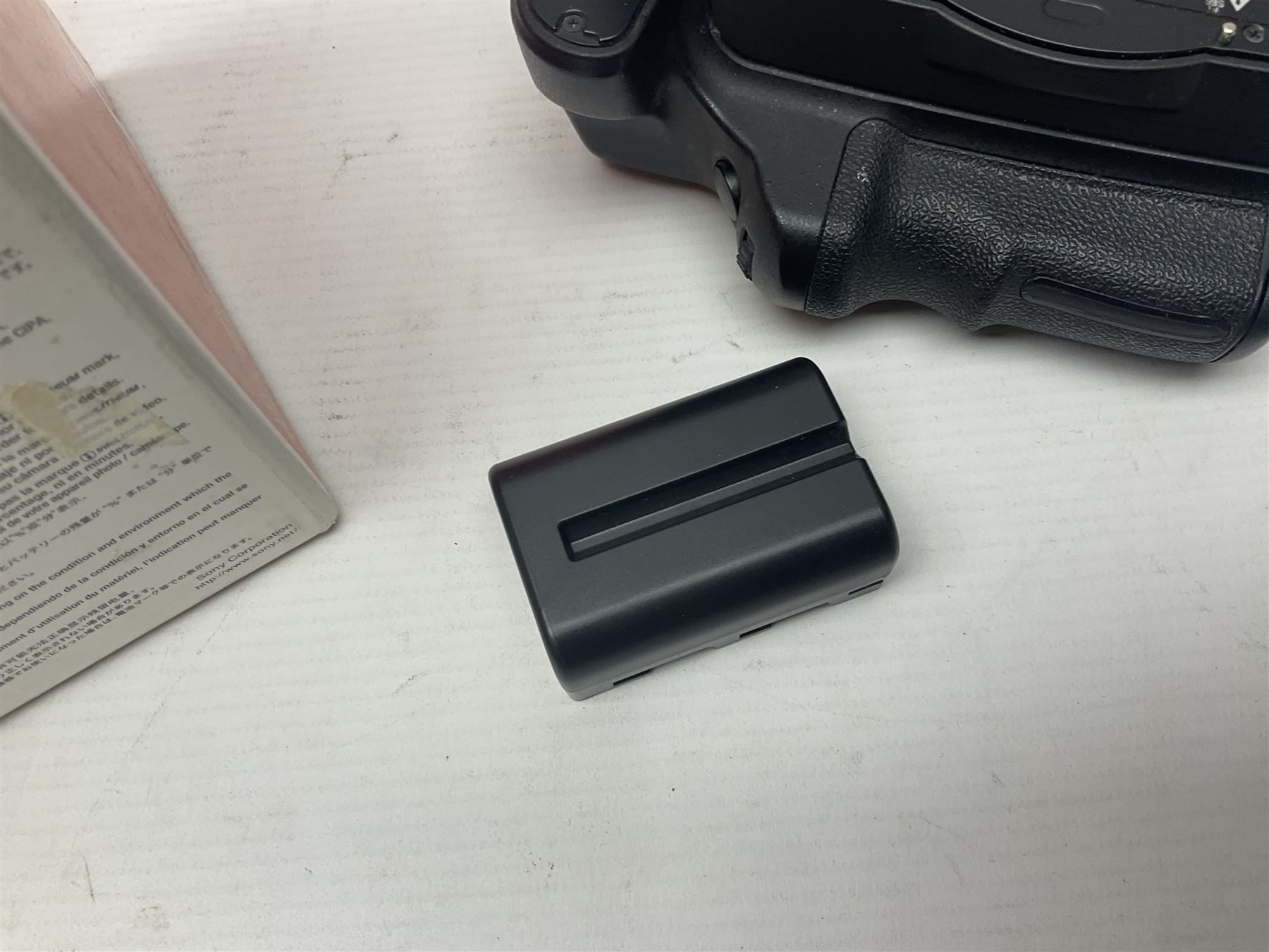 Sony Alpha A700 camera body, serial no 2340937, Sony Alpha A77 camera body, serial no 0715406, together with Sony angle finder and two firm holding grips, all with original boxes  
