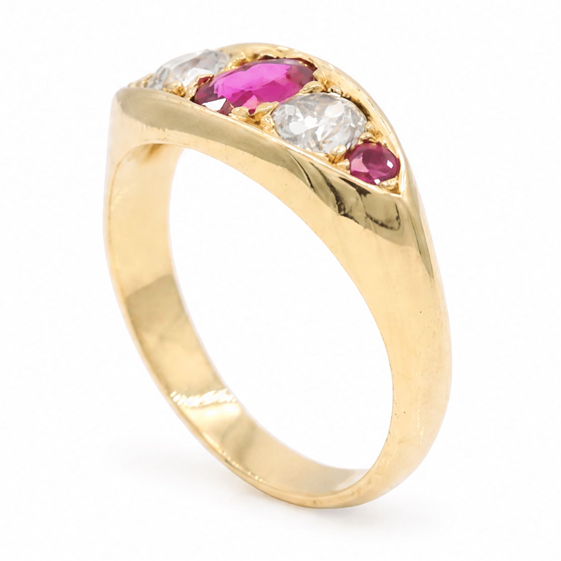 Early 20th century gold ruby and diamond five stone marquise set ring, principal oval cut ruby of approx 0.60 carat, flanked by two old cut diamonds and two round cut rubies, stamped 18ct, total diamond weight approx 0.80 carat