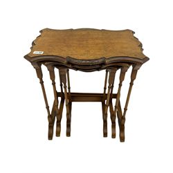 Late 19th century figured walnut nest of tables, shaped top
