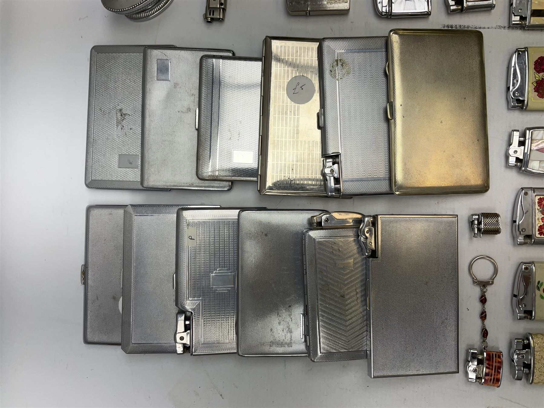 Collection of lighters to include examples by Ronson, Kingsway and Penguin, mother of pearl and engine turned examples, together with quantity of cigarette cases