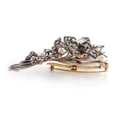 19th century gold and silver diamond and pearl en tremblant detachable brooch, the flower tremblant with a principal old cut diamond of approx 1.90 carat, the petals and stamen set with old cut and rose cut diamonds, total diamond weight approx 9.10 carat, to a foliate spray set set with further rose cut diamond and white / pink / cream pearls and ribbon tie