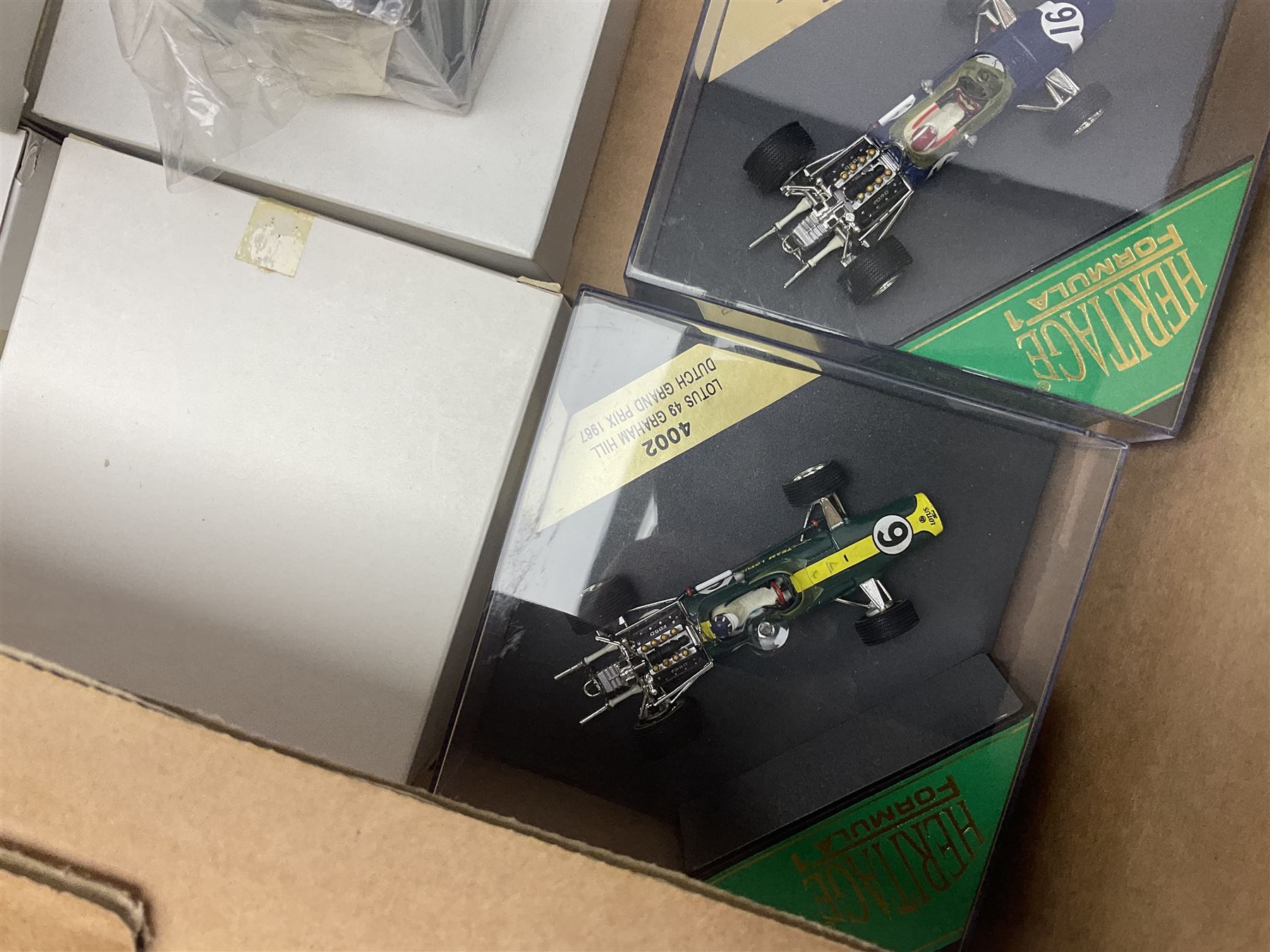 Heritage - thirty-five die-cast model racing cars comprising twenty-five Heritage Formula 1 1:43 scale models including Ferrari, Lotus, Yamaha etc; and ten Special Edition models including Williams Renault Ayrton Senna, David Coulthard and IndyCar, etc with certificates; and a Heritage Classics Damon Hill helmet; all in display boxes, many with original packaging (36)