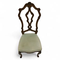 20th-century set of four French provincial-style stained beech dining chairs, pierced cartouche back with fan carving, with a scroll moulded frame above a padded serpentine seat on cabriole legs 