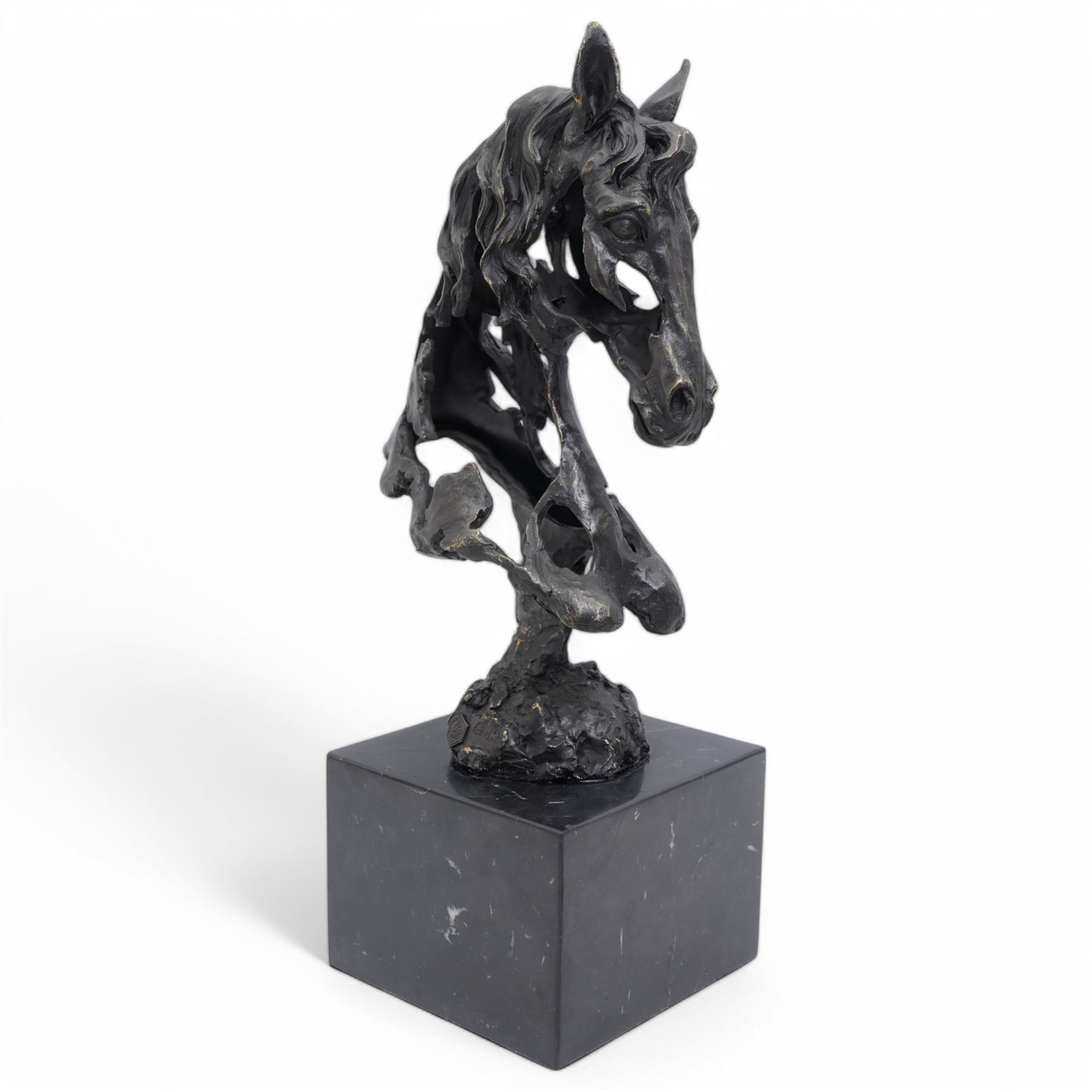 Bronze figure, modelled as a stylised horses head, upon a square marble plinth, signed and bearing foundry mark, overall H41cm