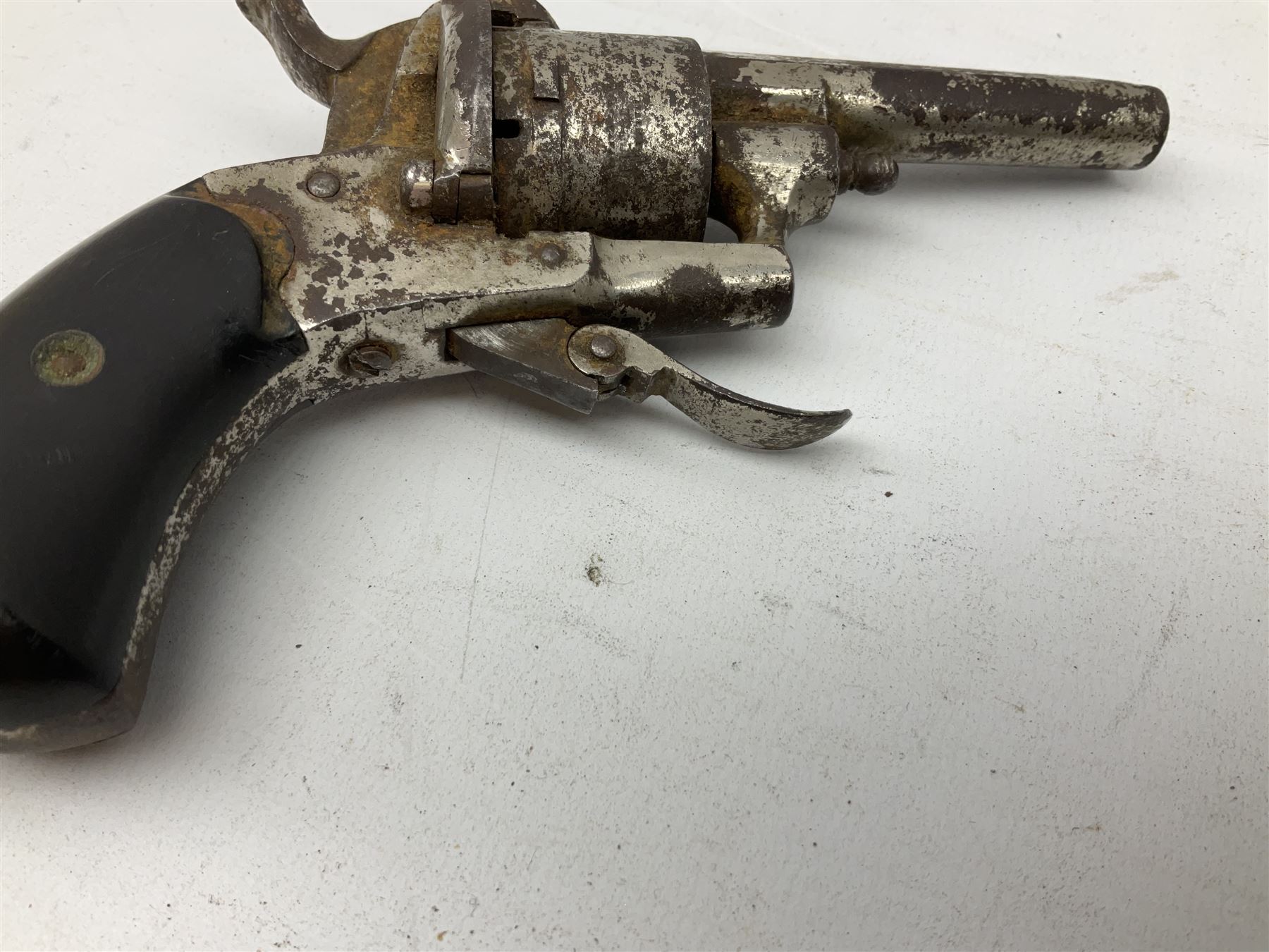 19th century 7mm six-shot pin-fire revolver, with folding trigger, two-piece ebonised grip and ejector rod in butt L17cm