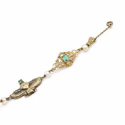 Early 20th century French 18ct gold Egyptian Revival bracelet, three winged sphinx motif panels, each set with a square cut emerald and four rose cut diamonds, spaced by six white / cream pearls and three scrolling openwork links, each centred with a square cut emerald, French assay marks