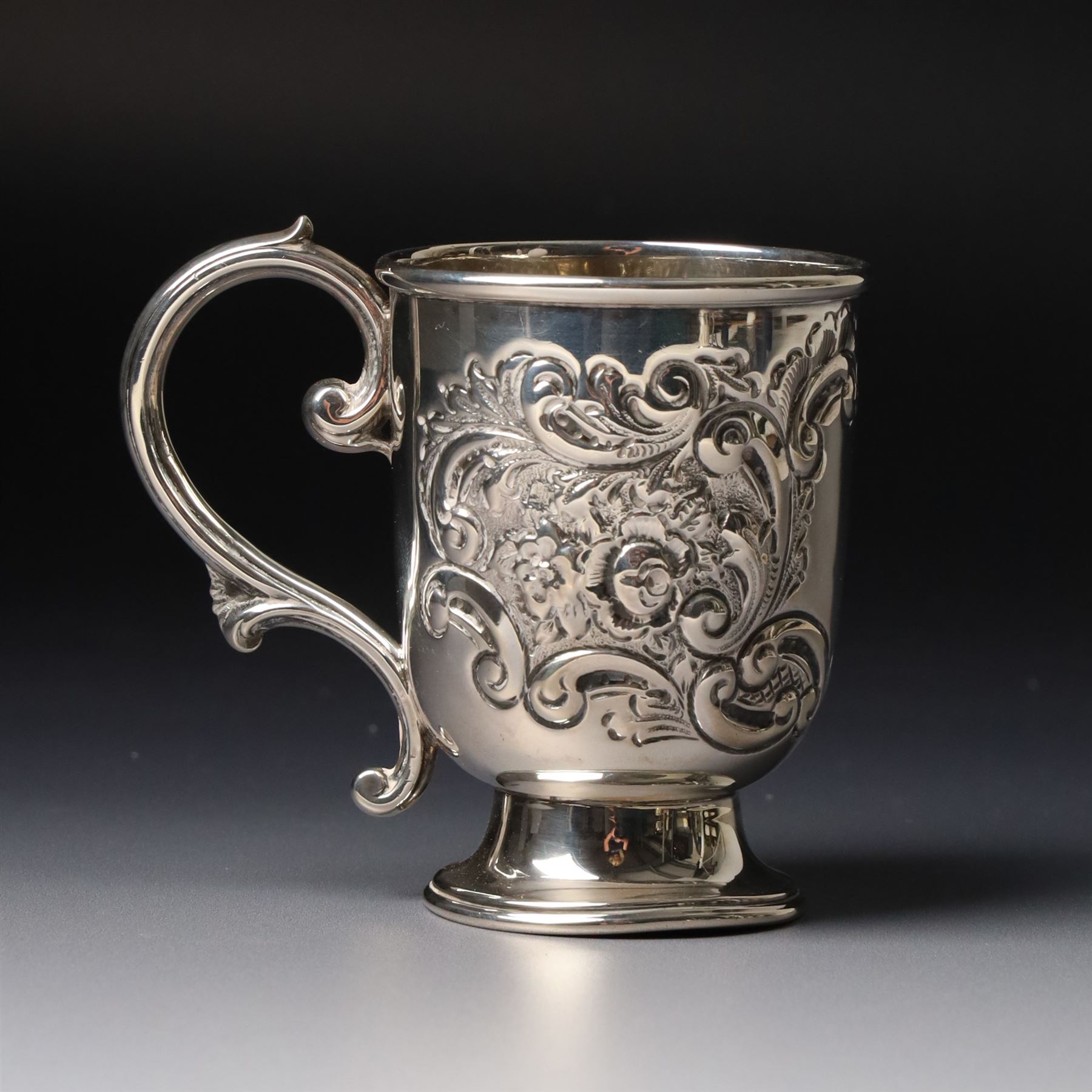 Edwardian silver christening mug with engraved decoration H8cm Birmingham 1902 and two others 1900 and 1902