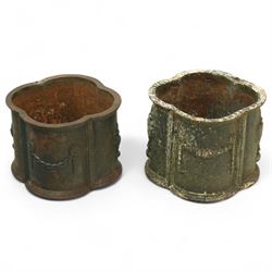 Matched pair of 20th-century cast iron neoclassical style planters, scalloped form with or...