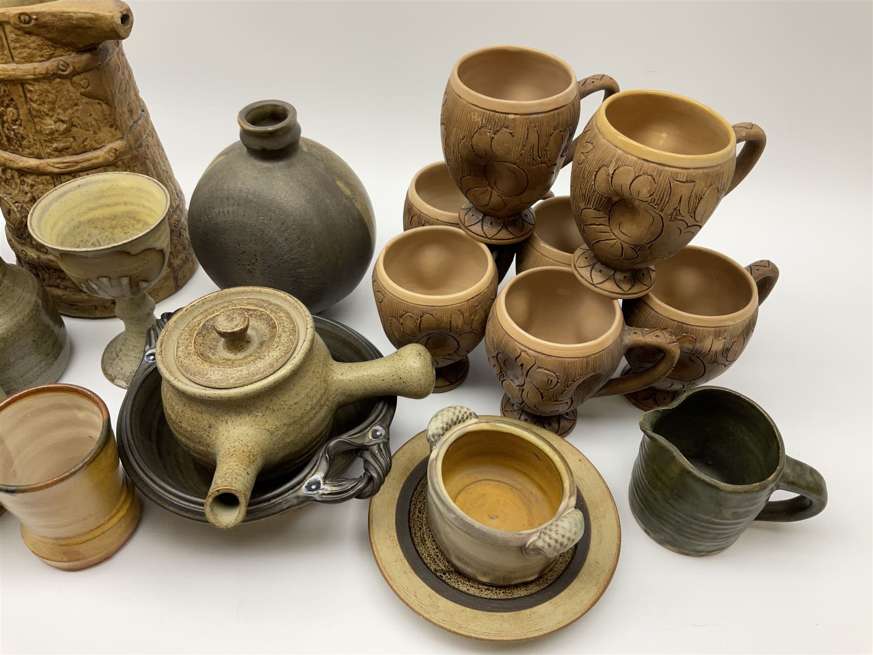 Studio pottery, to include Borgh pottery twin handled bowl, Hillstonia naturalistically modelled jug, set of seven mugs, jug and two vases.