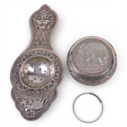 Sri Lankan silver tea strainer and bowl, embossed with elephant decoration and a silver child's bangle