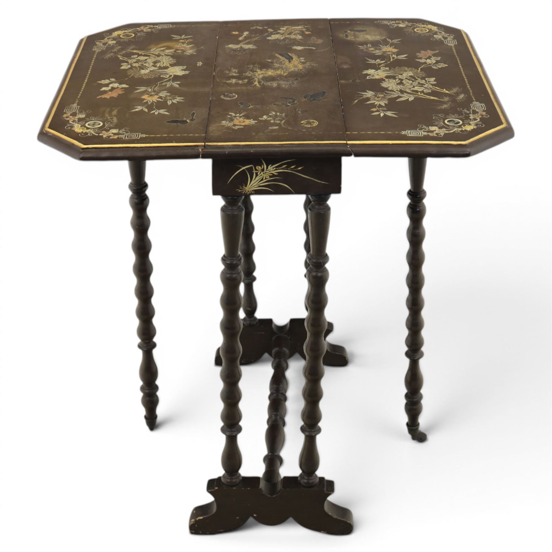 Chinoiserie style gate leg table, with gilt painted floral design, raised on bobbing supports, on sled feet