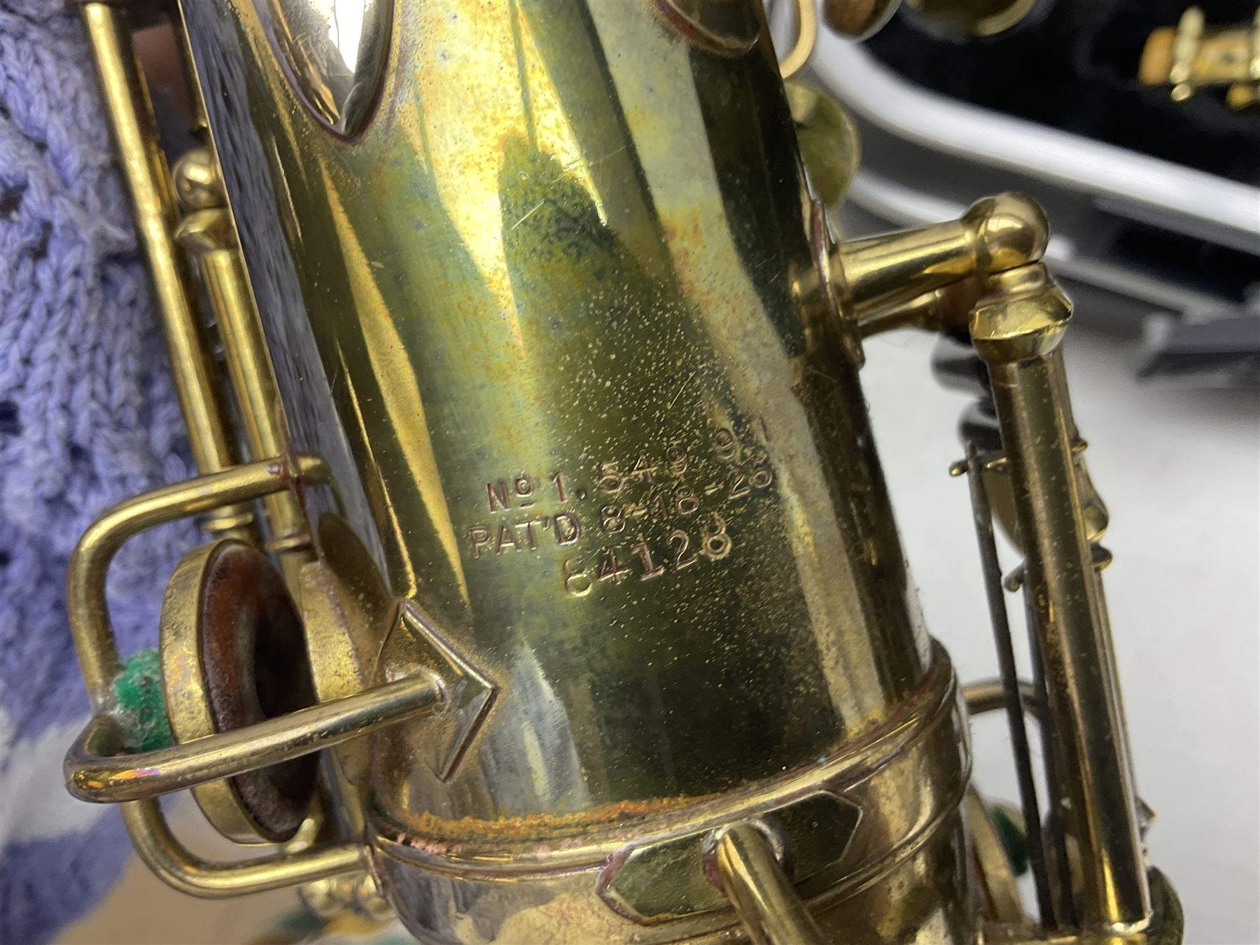 Lacquered brass 'King' alto saxophone inscribed Made by the H.N. White Co.' (Cleveland Ohio) with crook, serial no.84128; also stamped No.1 549 911 and Pat D 8-18-25; in fitted carrying case 