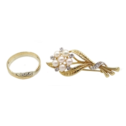 White and yellow gold three stone diamond ring and a gold pearl and diamond flower design brooch, both hallmarked 9ct