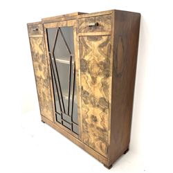 Art Deco walnut display cabinet, central astragal glazed door flanked by two drawers and two cupboards 