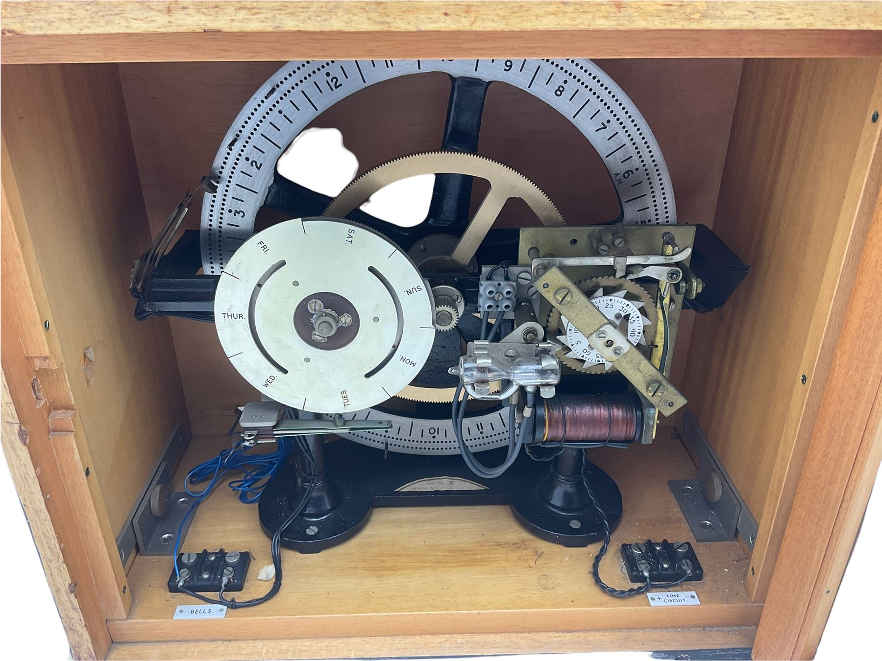 A mid-20th century Gent of Leicester(Blick Electric) Pulsynetic Master Clock in a full length glazed wooden case, with a square white dial with Arabic numerals, minute markers and baton hands, with pendulum and a record card dating from the 1970’s. 
This master clock would have been wired to send time signals to other slave dials in a large building, frequently used in hospitals, schools and factories during the 20th century
With a second electrical movement housed in a glazed square cabinet.


