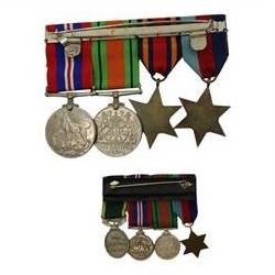 WWII British medal group comprising 1939-45 star, Burma Star, war medal and defence medal on a single bar, together with a set of WWII miniatures 1939-45 star, War medal, Defence medal and territorial medal 