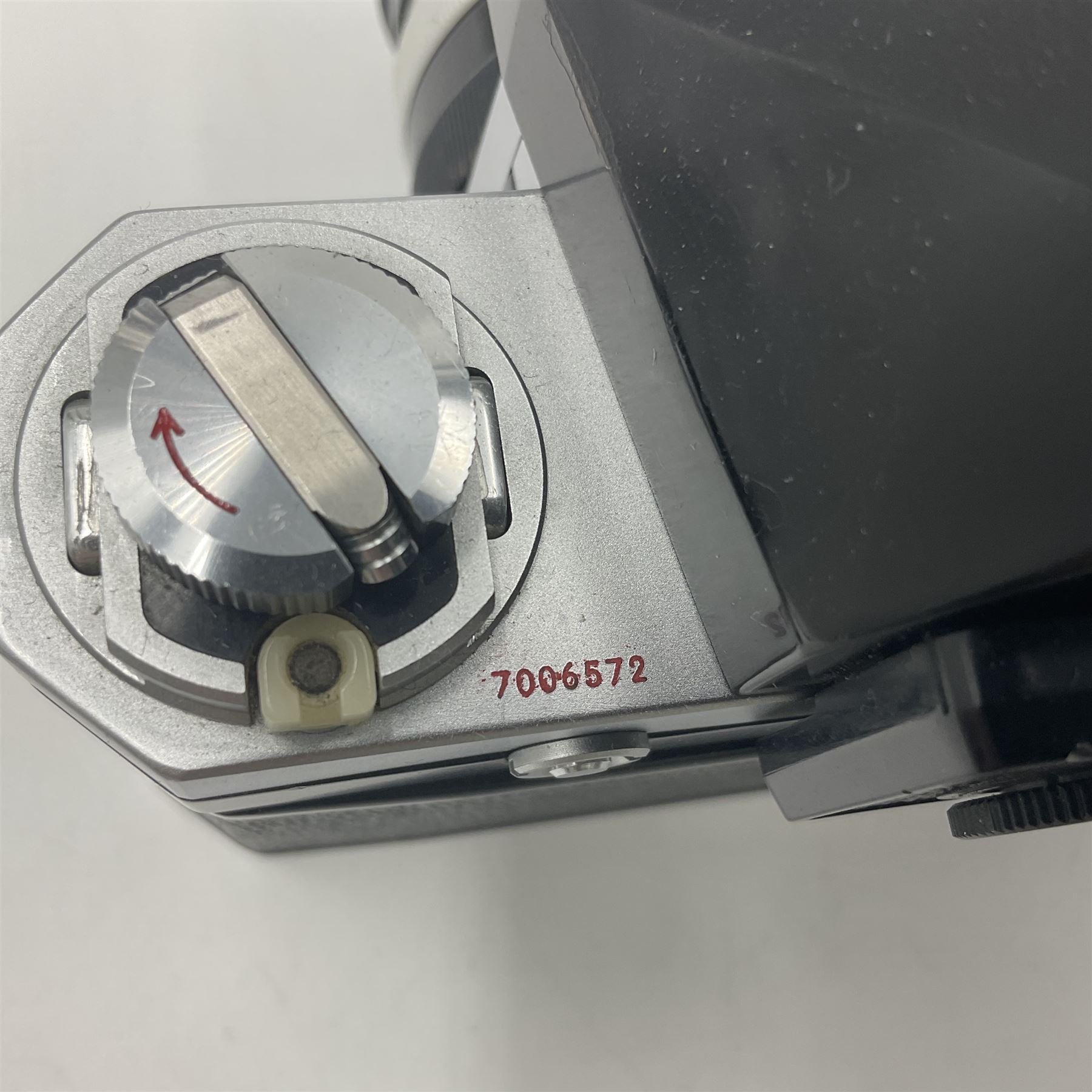 Nikon photomic Ftn camera body, with red engraving, serial no 7006572, circa 1969, with 'Nikon NIKKOR-O Auto 1:2 f=35mm' lens, serial no. 830478