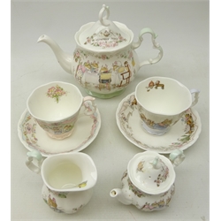  Royal Doulton 'Brambly Hedge Tea Service' comprising teapot, milk jug, with box & miniature teapot and two tea cups and saucers in 'The Wedding' and 'The Birthday' (7)  