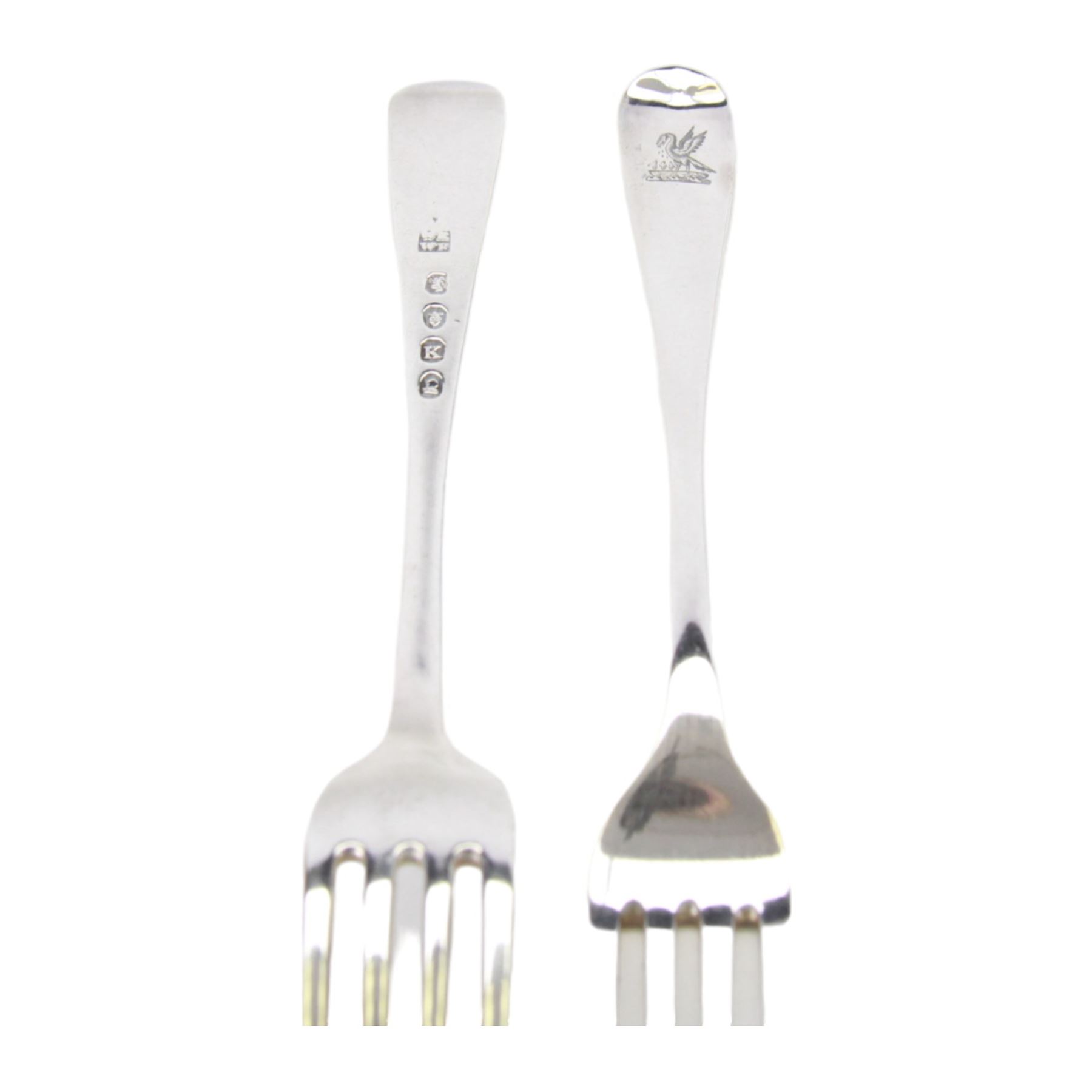 Georgian silver matched Old English pattern canteen for twelve place settings, comprising table spoons, table forks, dessert spoons, and side forks, hallmarked London, dates ranging from 1798 to 1828, various makers marks, contained within a later oak fitted box with engraved brass cartouche to the hinged cover
