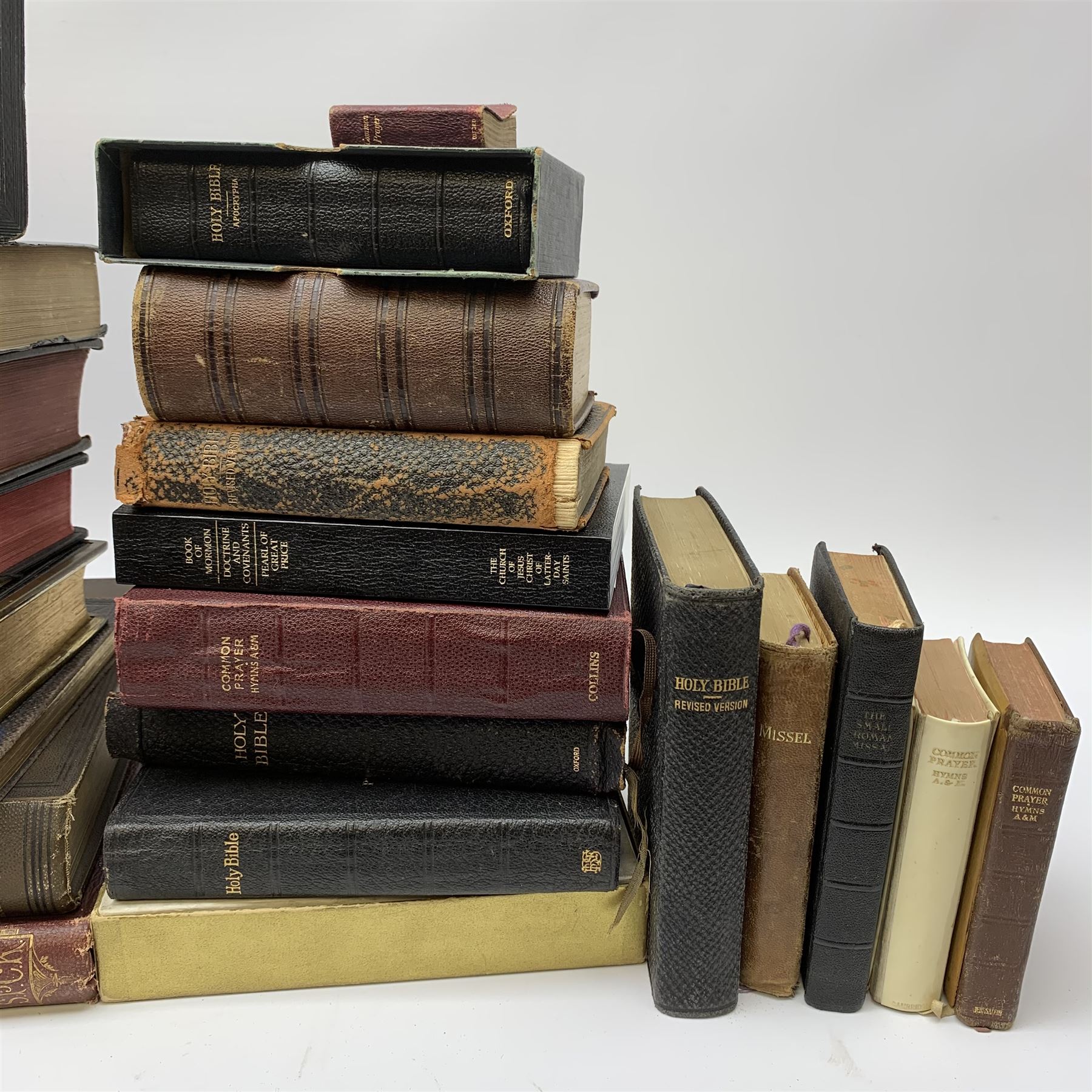 Twenty-six Victorian and later Bibles and Prayer Books etc, some with leather bindings, including 1922 Hebrew bible.