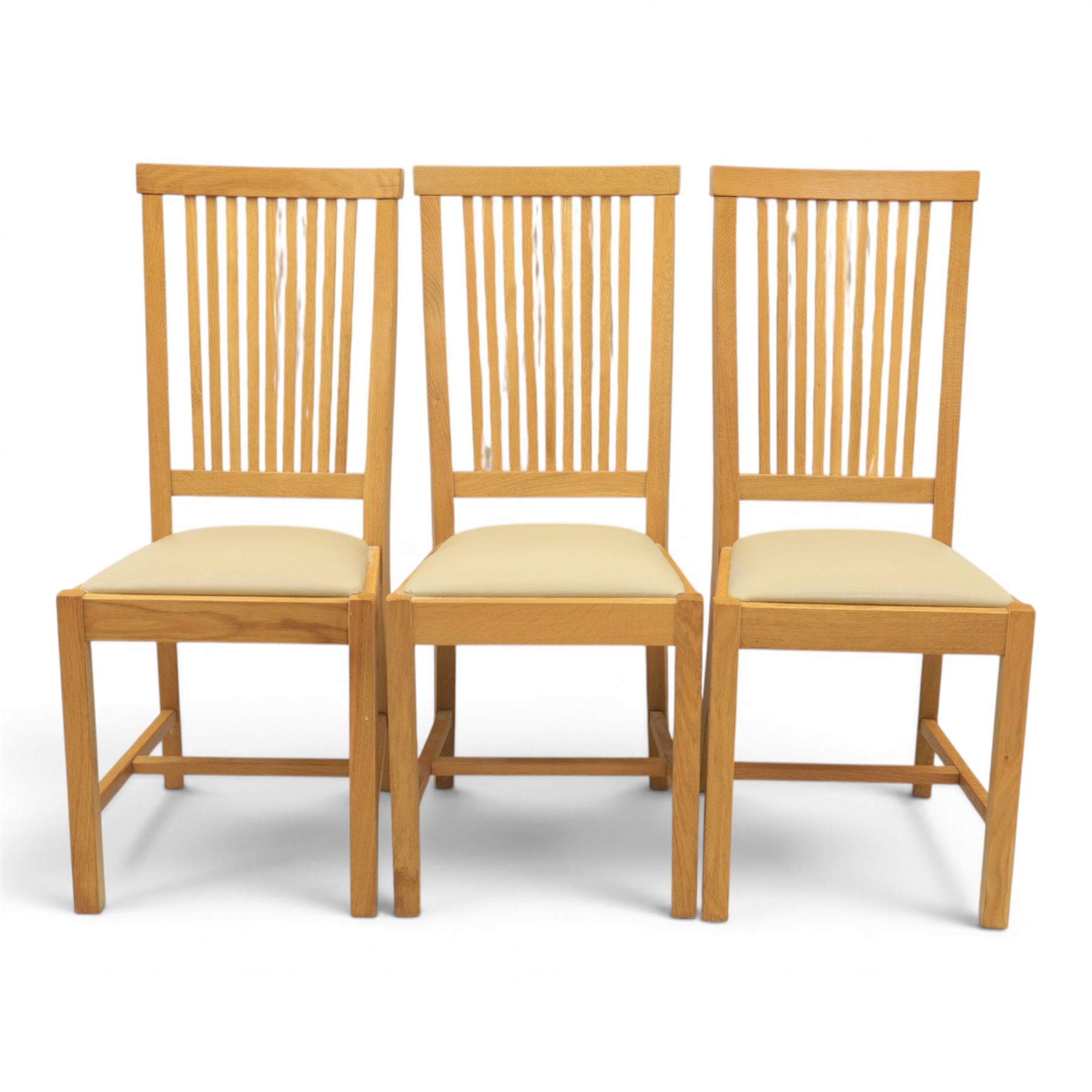 Contemporary oak dining extending table and set of six chairs, with additional leaf  extending to 182cm, chairs with cream upholstered seat
