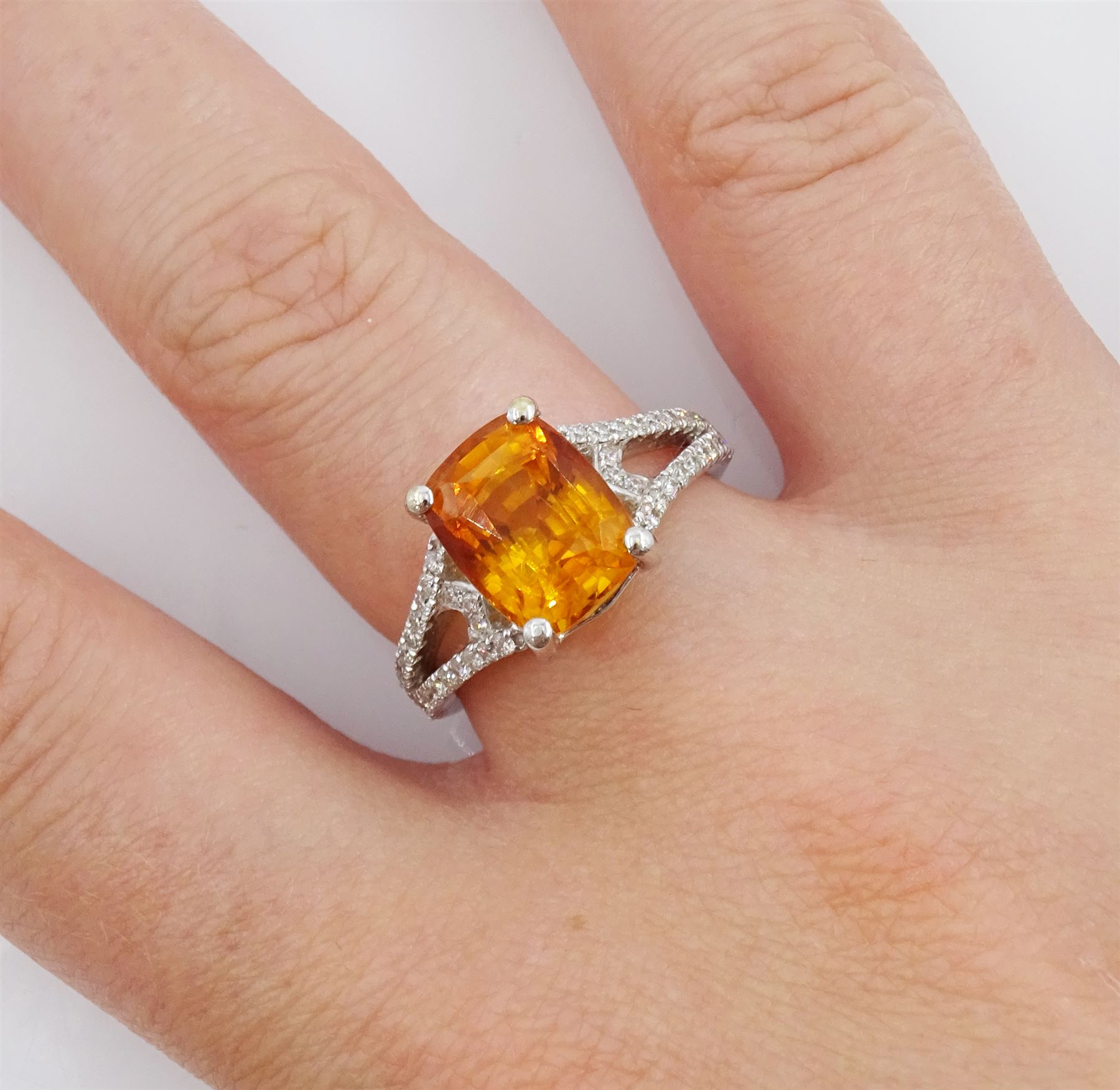 18ct white gold orange / yellow sapphire ring, with diamond set shoulders, hallmarked, sapphire approx 4.80 carat