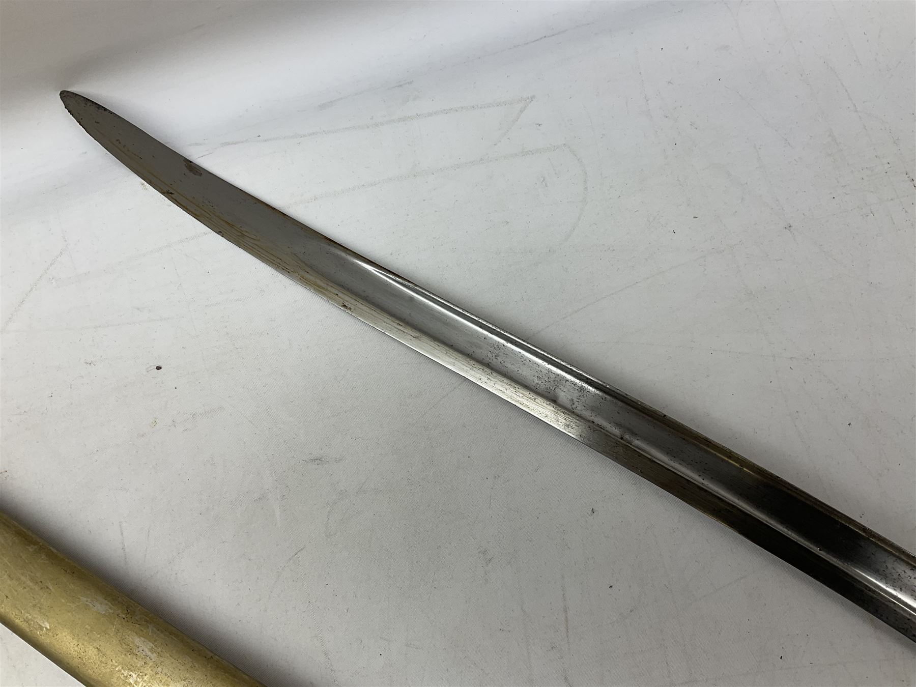 French Model 1866 sabre bayonet with 57cm fullered steel curving blade; in steel scabbard L71cm overall; another Model 1866 sabre bayonet lacking scabbard; and British Pattern 1856 sword bayonet (no scabbard) (3)