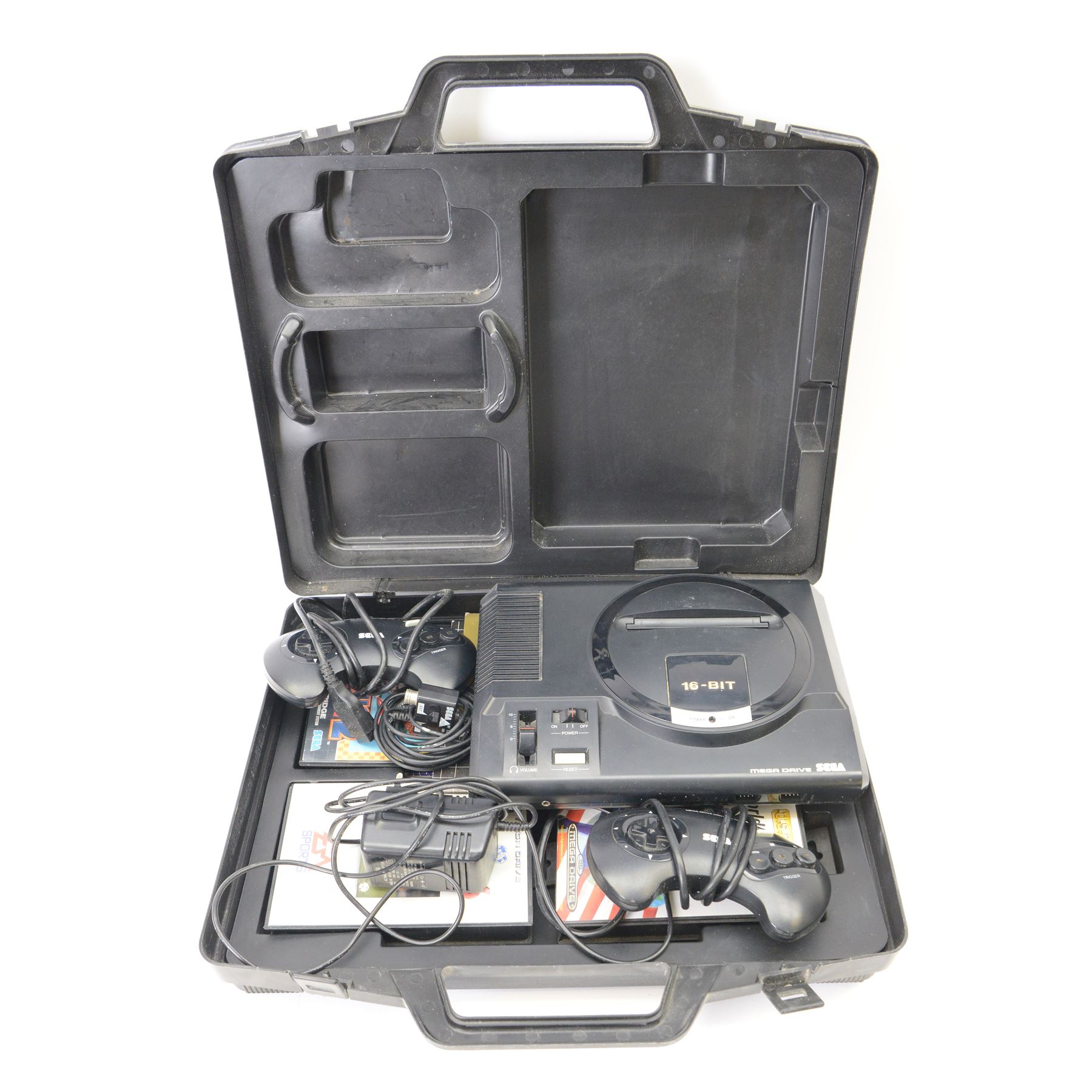 16-Bit Sega Mega Drive console with two controllers and four games, comprising Fifa 96, Sonic The Hedgehog 2, Sonic The Hedgehog Pinball and World Cup USA 94, contained within fitted plastic carrycase with instruction manual and cheats book