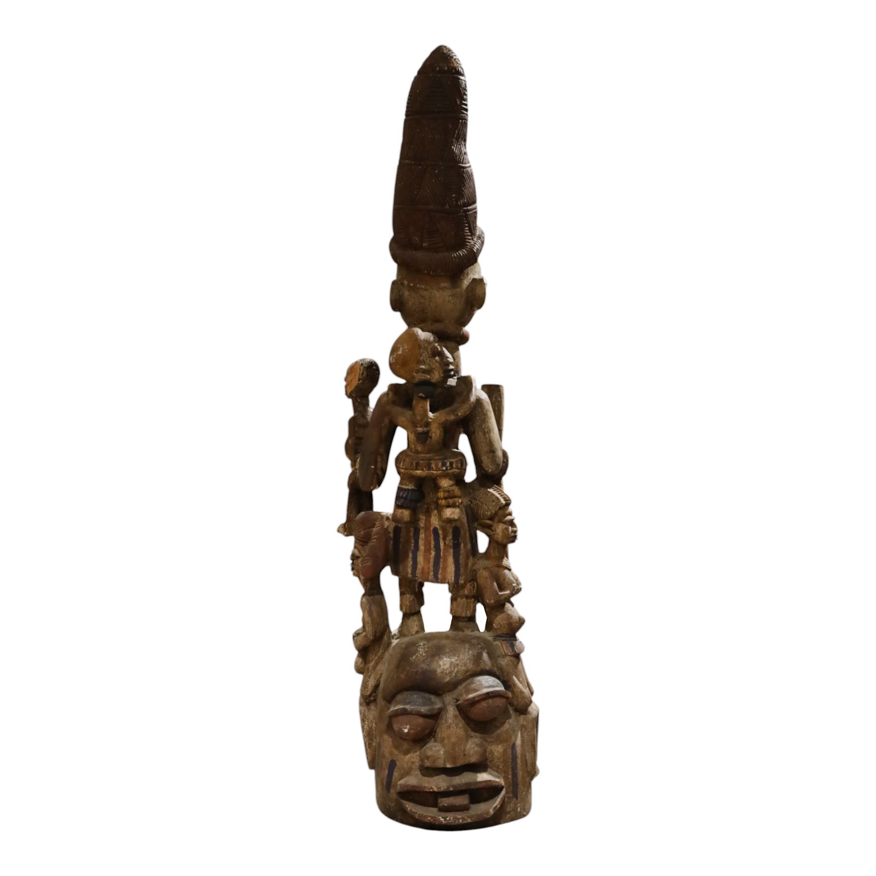 African tribal maternity figure of a woman with children, probably Yoruba, carved wood, the woman stood upon a craved mask, H133cm