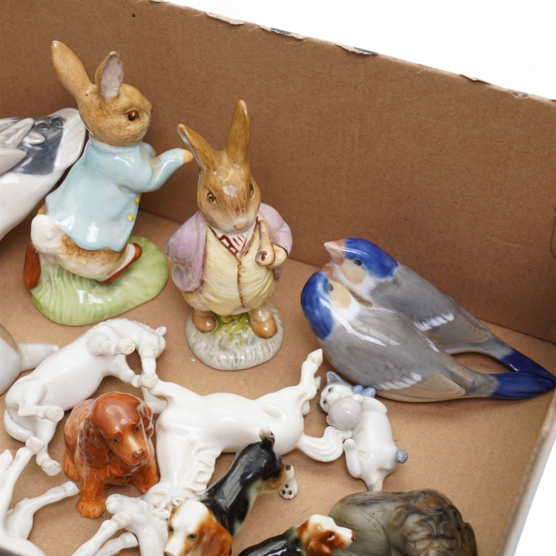 Royal Copenhagen duck No.1934, another of a puppy No.1311, another of two birds No.6811, two Beswick Beatrix Potter figures and other animal ornaments