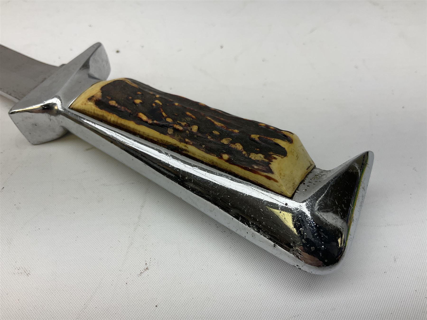 German ERN Wald-Solingen Art Deco style hunting knife with 13cm Bowie type blade and chrome fittings with antler grip; in leather sheath L24.5cm overall; and Bianchi Rastignano Aeronautica Militare combat knife with 15.5cm Bowie type saw-back blade and stacked leather grip (2)