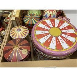 Collection of circus and fairground collectables, to include teapots, biscuit tins, including musical examples, and four Circus/fair themed books, including two library first editions
