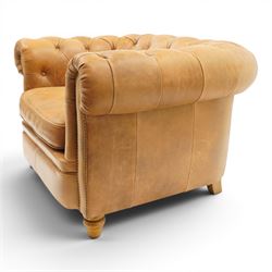 Alexander James - Chesterfield tan armchair, button backed with scrolled arms, brass studded trim raised on light wood turned feet