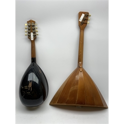 Italian lute back mandolin with black lacquered segmented rosewood back and spruce top L64cm; together with a Russian three-string balalaika of typical triangular form with faceted back and spruce top, bears label, L70cm (2)
