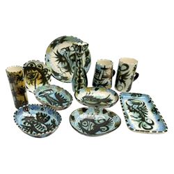 20th century Celtic Pottery, Newlyn, figure of a stylised cat, together with various vases, cups, mugs, ovoid shape dishes, other shallow dishes and plates etc, all predominantly decorated with sponged blue ground, with dark stylised phoenix, boat in a seascape and horse stylised patterns, tallest H20cm (8)