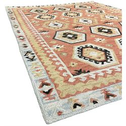 OKA - Turkish design peach ground rug, the field decorated ejder motifs within hooked and geometric design borders 