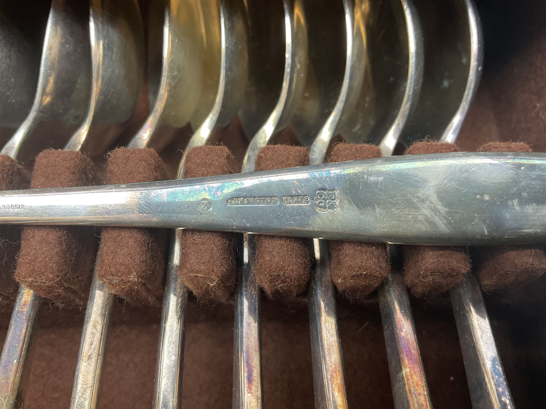 Elkington & Co part canteen of silver plated and stainless steel cutlery, to include simulated ivory handled examples, housed in oak and mahogany case, lock plate stamped 'Acme, British Made', W49cm D31cm H18cm